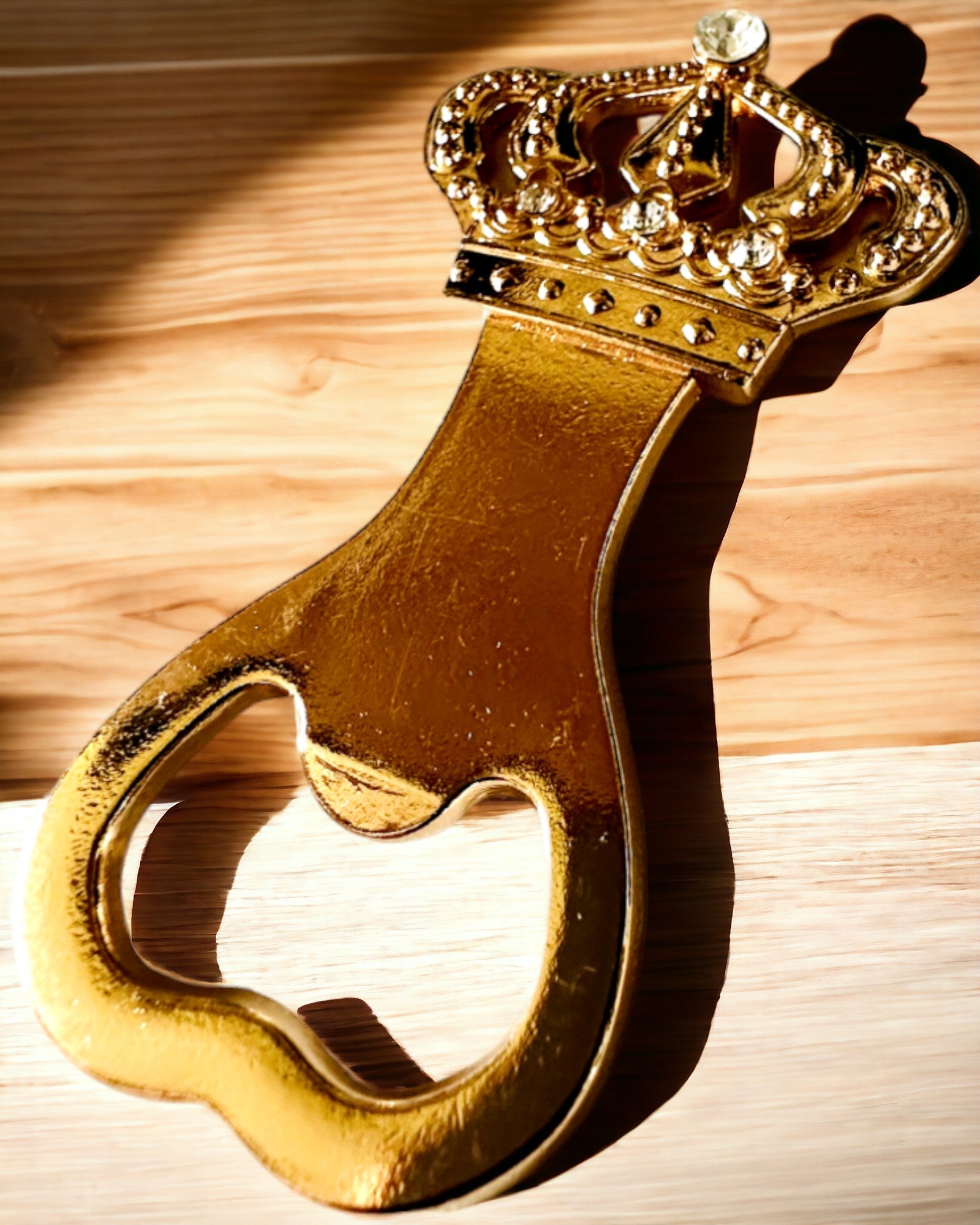 Bottle opener "King's Crown" in gold color, personalization option with engraving.